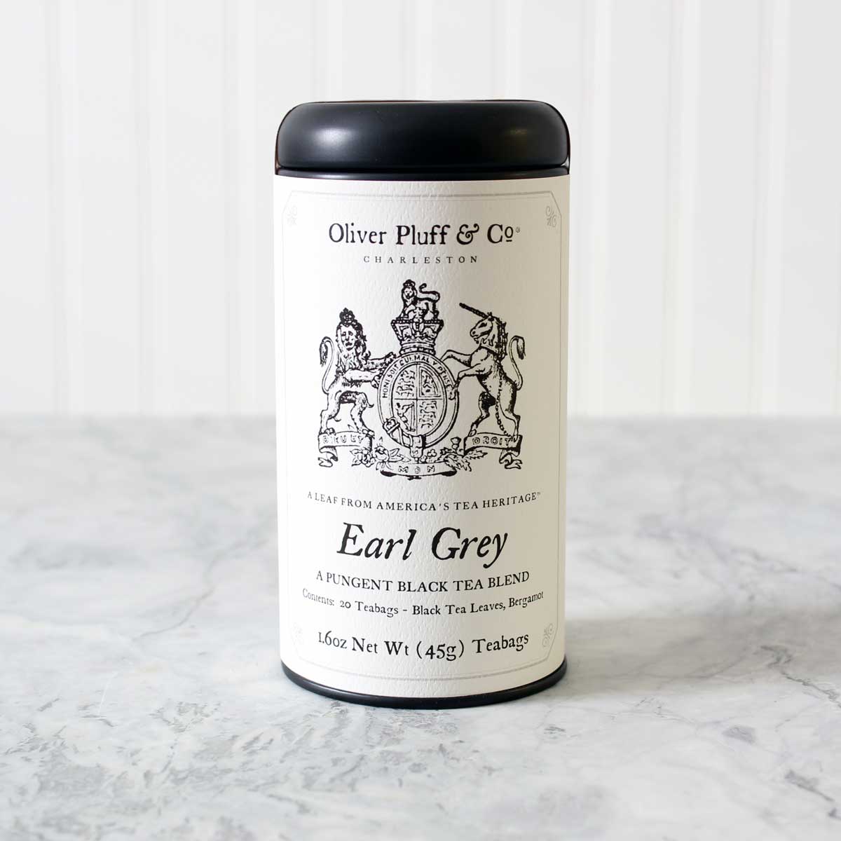 Earl Grey Teabags in a stylish matte black tea tin, featuring pyramid style teabags with bergamot citrus aroma.