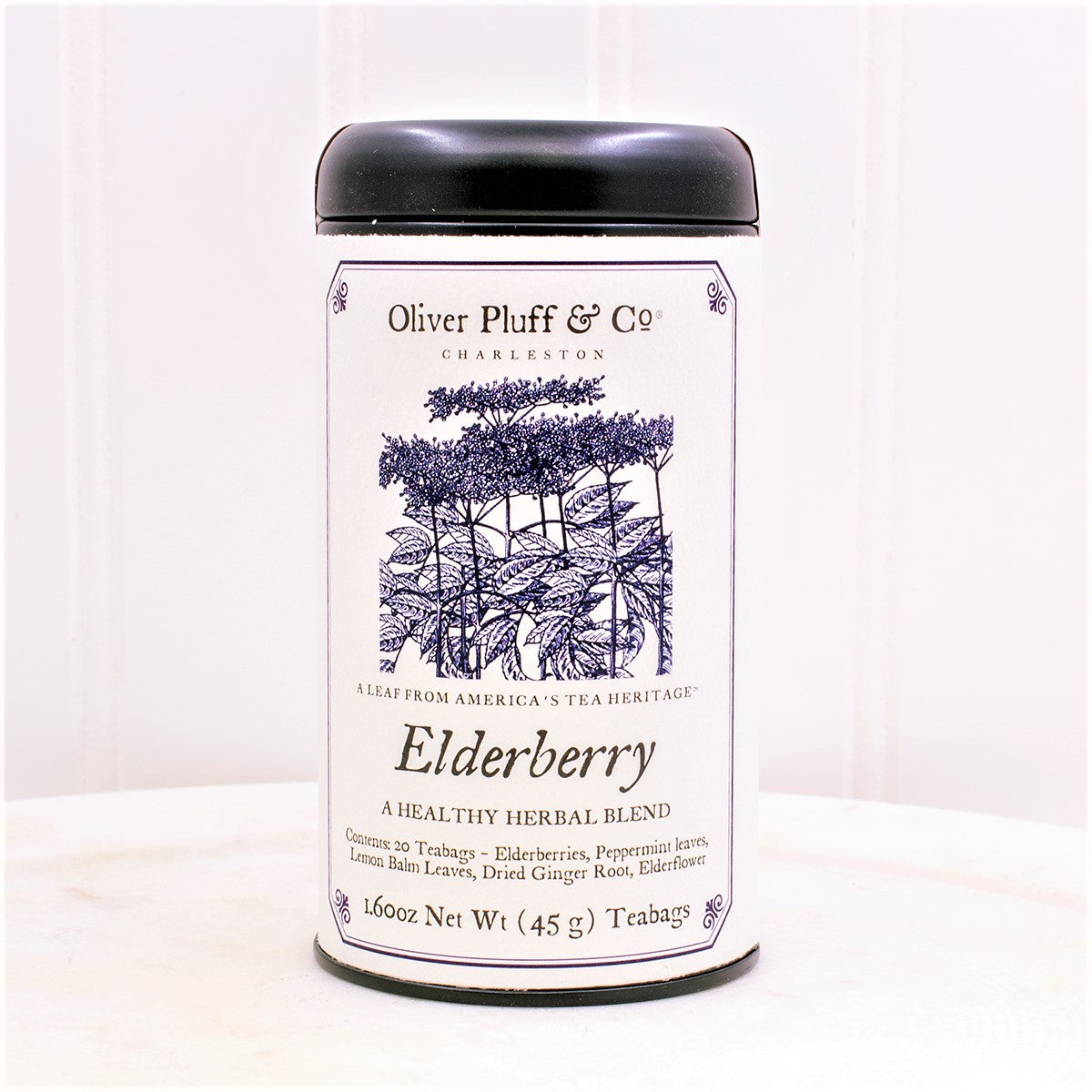 Elderberry Teabags Tea Tin featuring a matte black design with 20 pillow sachet teabags inside, showcasing natural ingredients.