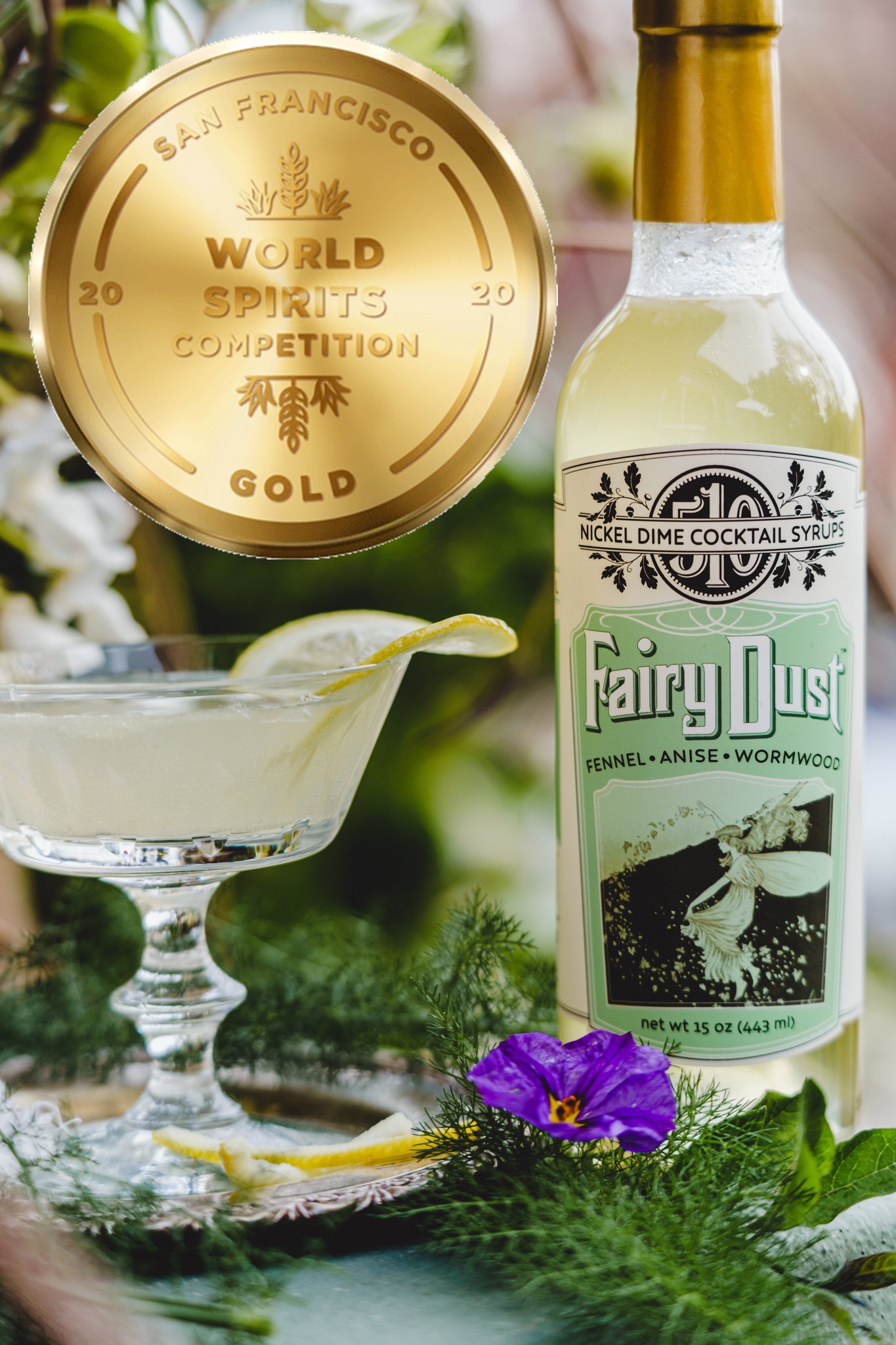 A bottle of Fairy Dust Syrup featuring a blend of fennel, anise, and wormwood, elegantly designed for cocktails and mocktails.