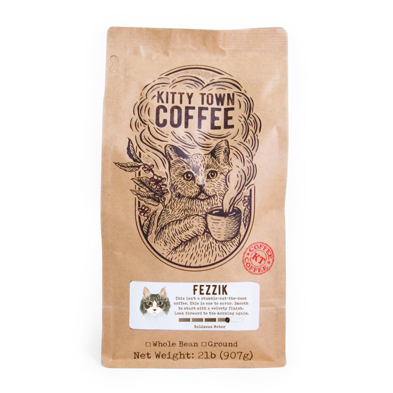 A bag of Fezzik Medium Roast coffee from Brazil, showcasing its rich, earthy design and hints of dark cocoa.