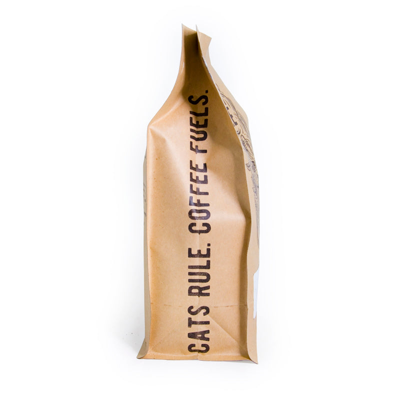 A bag of Fezzik Medium Roast coffee from Brazil, showcasing its rich, earthy design and hints of dark cocoa.