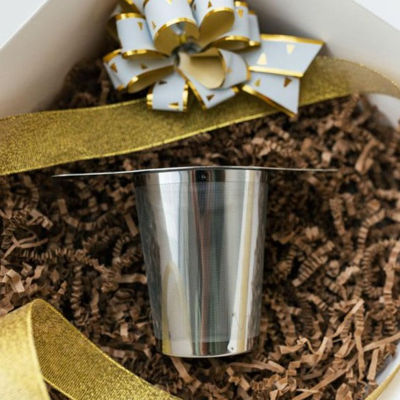 Flavored Looseleaf Gift Set featuring three tea blends and a stainless steel infuser, beautifully packaged for gifting.