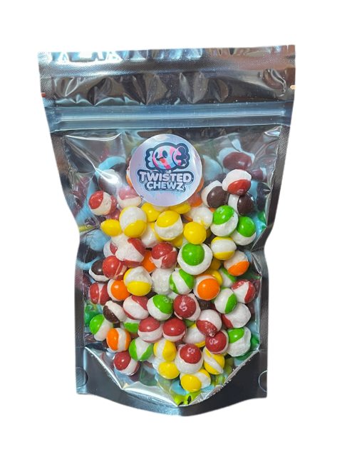 A colorful assortment of freeze-dried fruity poppers resembling Skittles, showcasing their vibrant colors and unique texture.