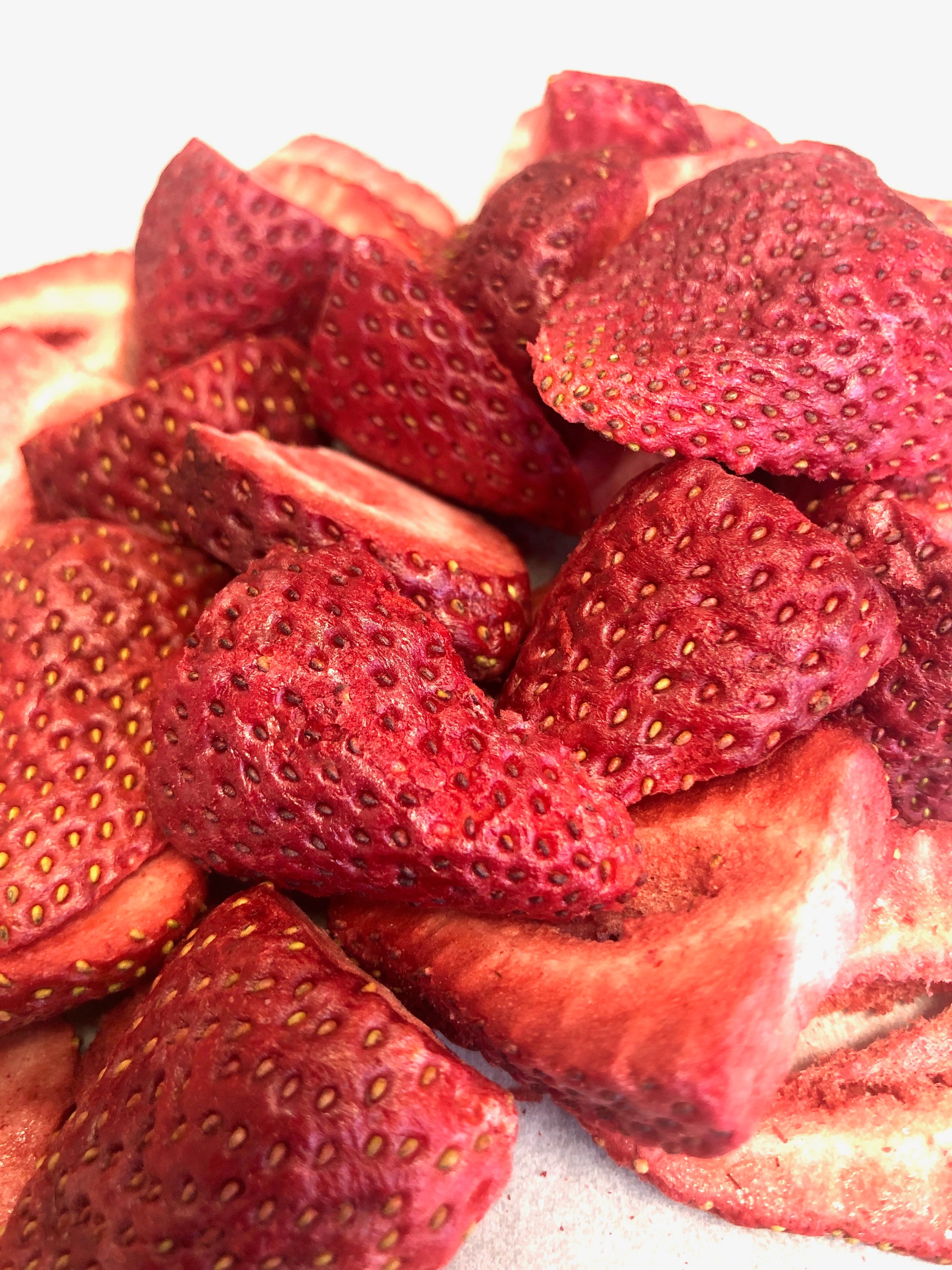 A resealable pouch of freeze dried strawberries showcasing vibrant red strawberries with a crunchy texture, perfect for snacking.