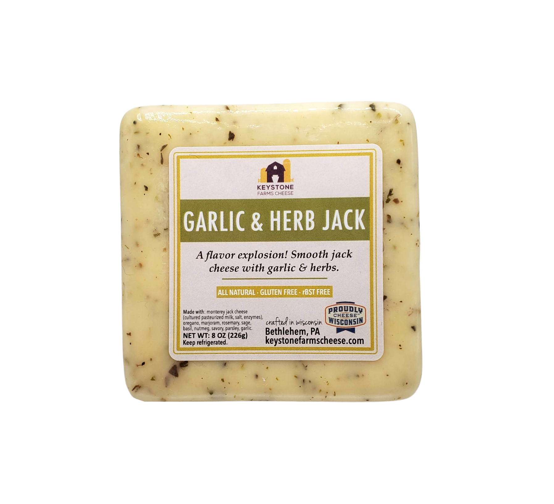 A block of Garlic & Herb Jack cheese with herbs and garlic, showcasing its creamy texture and rich flavor.