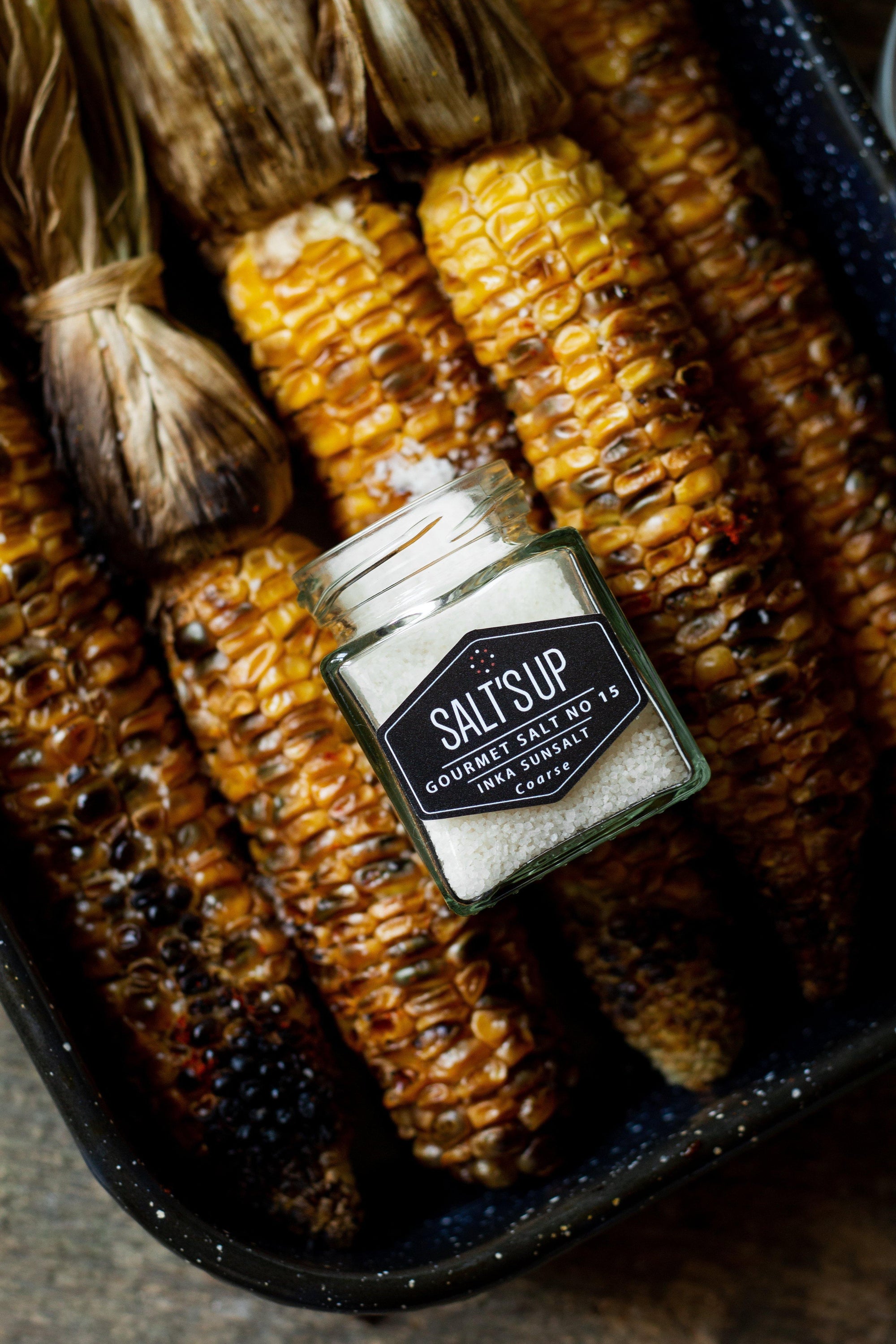 Gift box containing two jars of gourmet salt: Inka Sunsalt from Peru and Flor de Sal from Portugal, elegantly packaged.