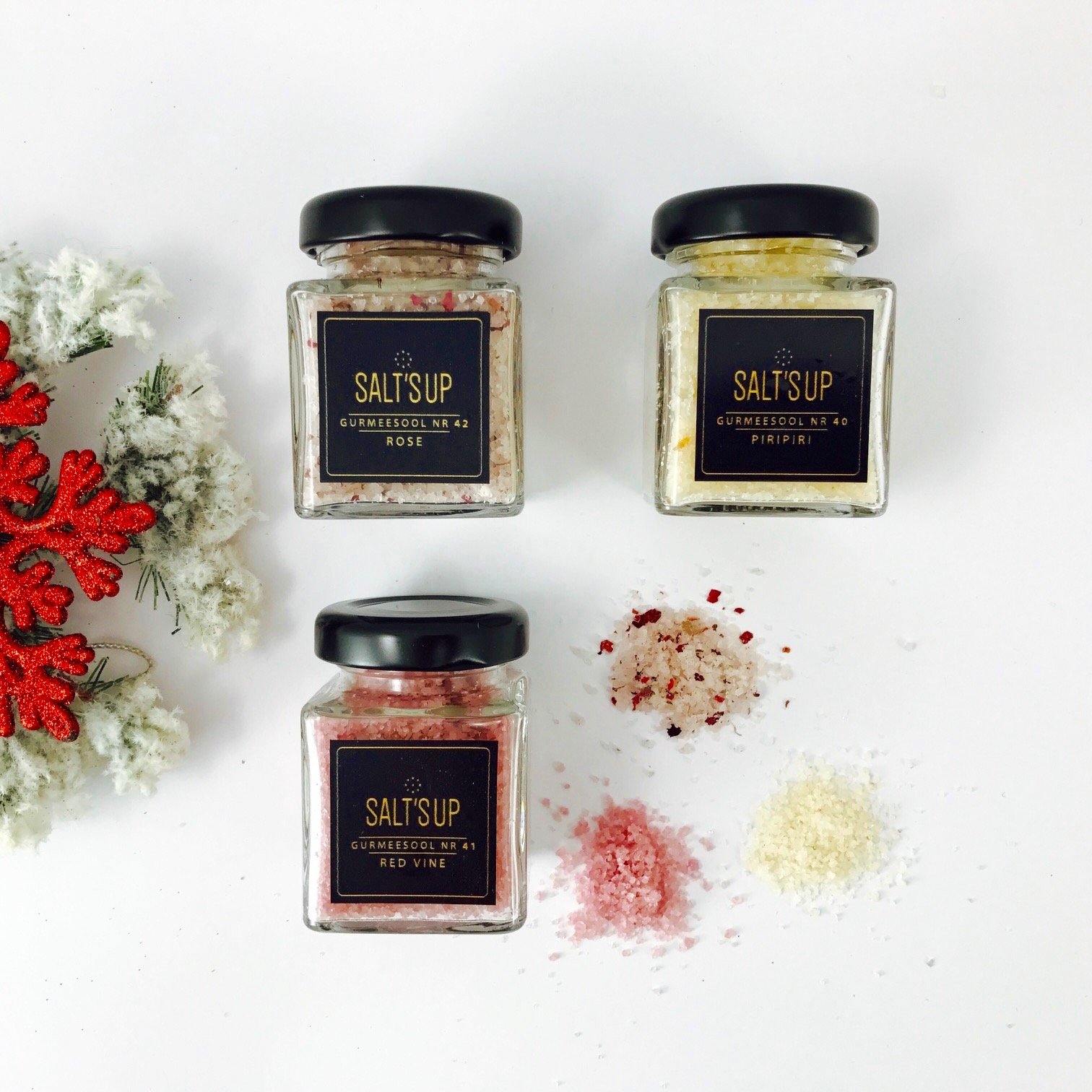 Gift box containing three jars of gourmet salt: PiriPiri, Red Wine, and Rose, elegantly packaged.