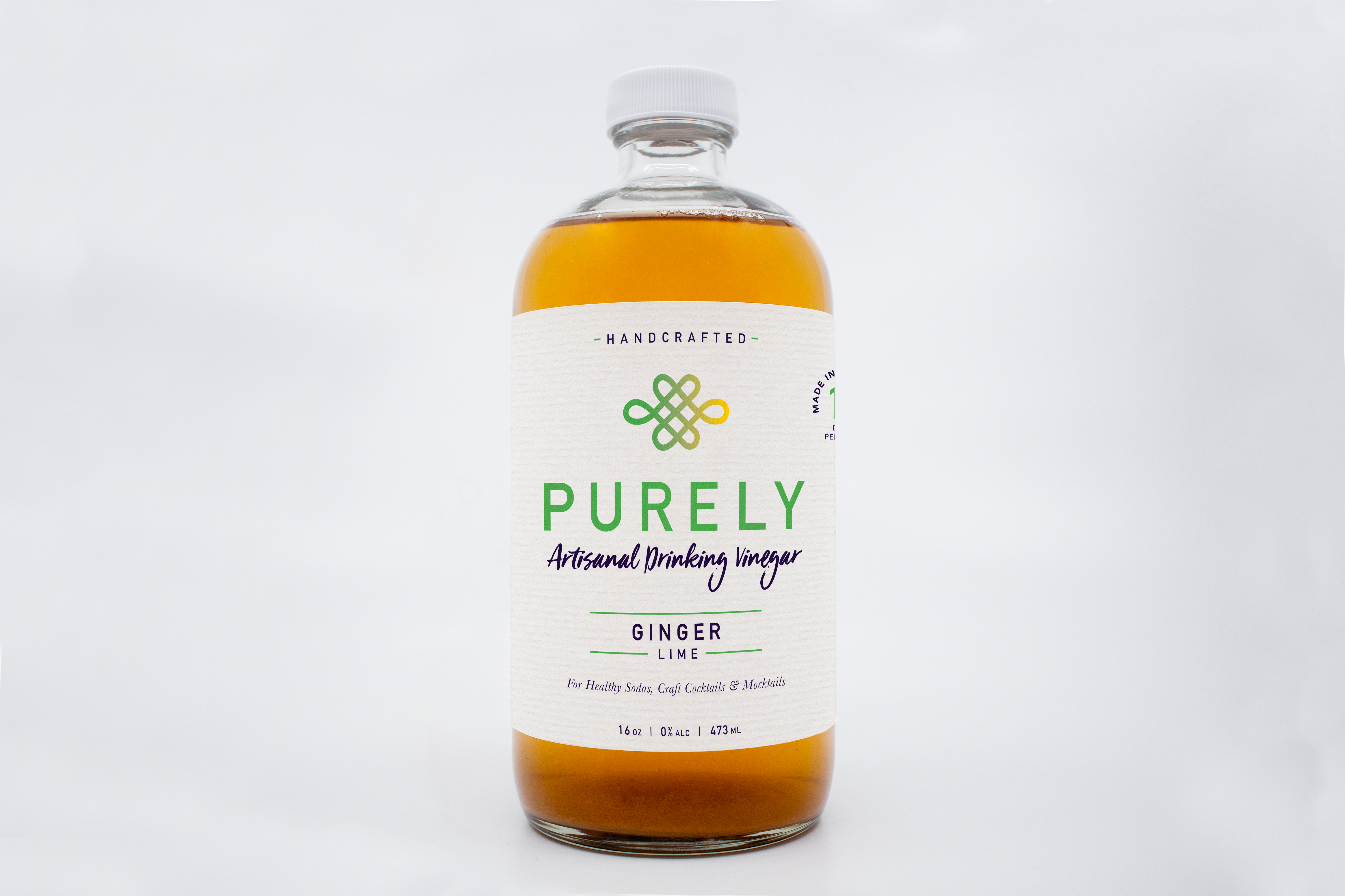 A 16oz bottle of Ginger Lime Infusion showcasing vibrant ginger and lime ingredients, perfect for cocktails and wellness.