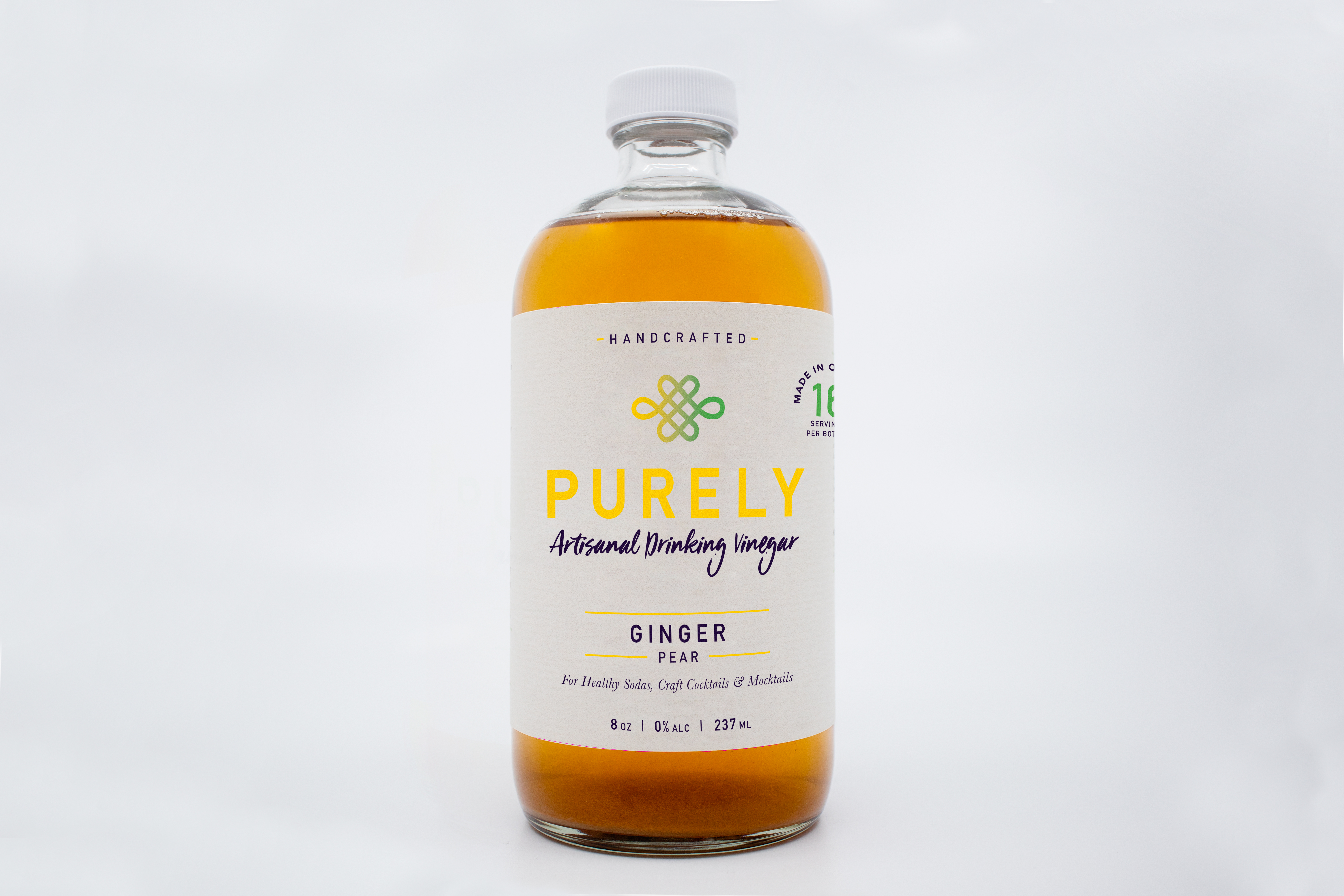 A bottle of Ginger Pear Infusion showcasing its organic ingredients and vibrant label, perfect for health enthusiasts.