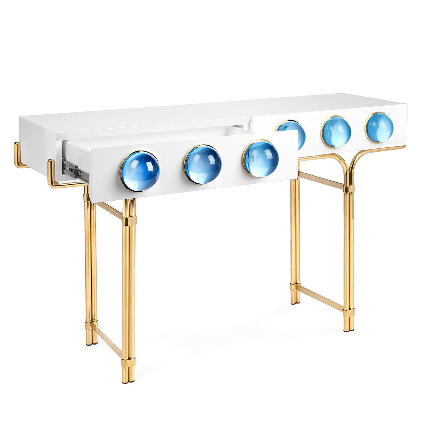 Globo Console featuring glossy white lacquer, brass framework, and blue acrylic cabochons.