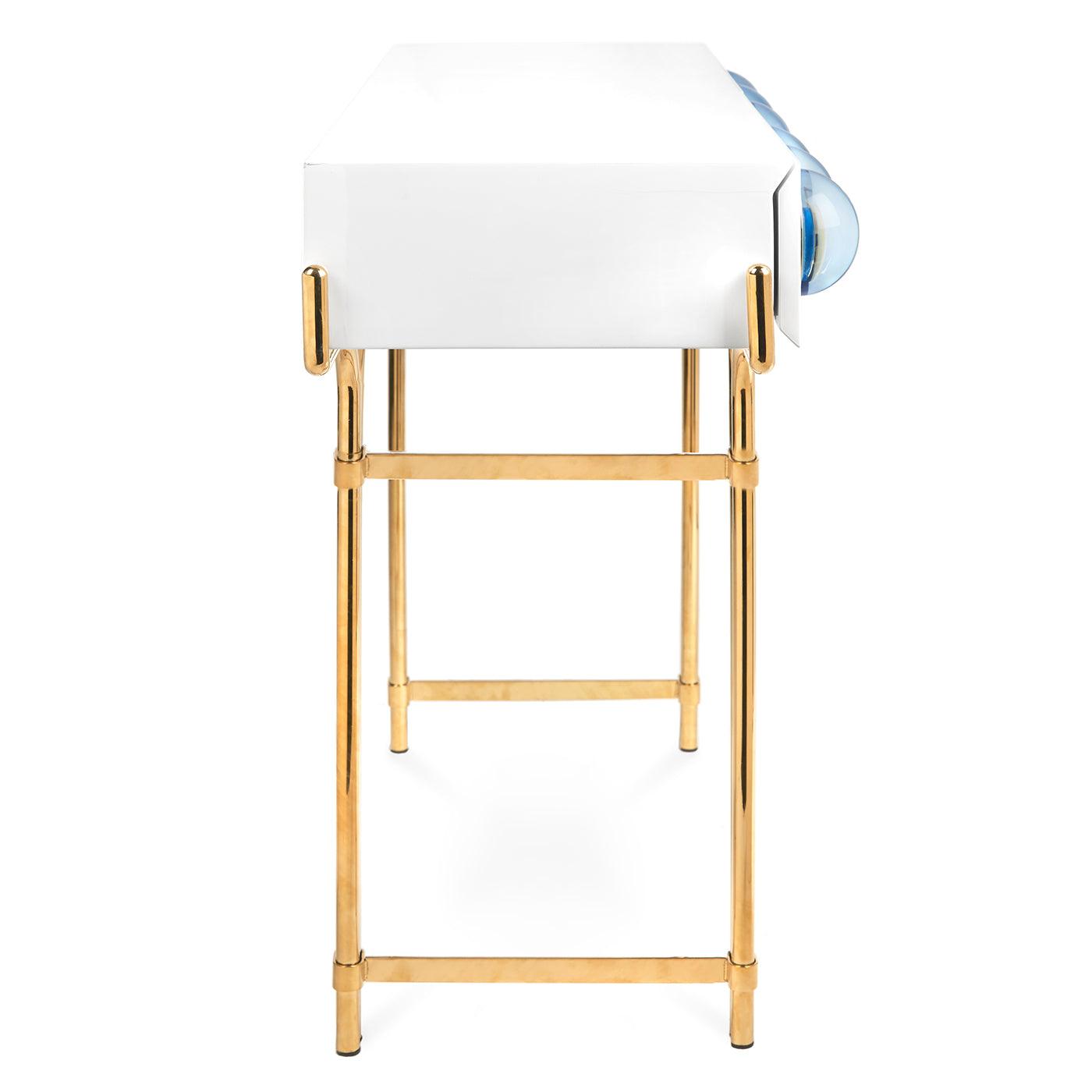 Globo Console featuring glossy white lacquer, brass framework, and blue acrylic cabochons.