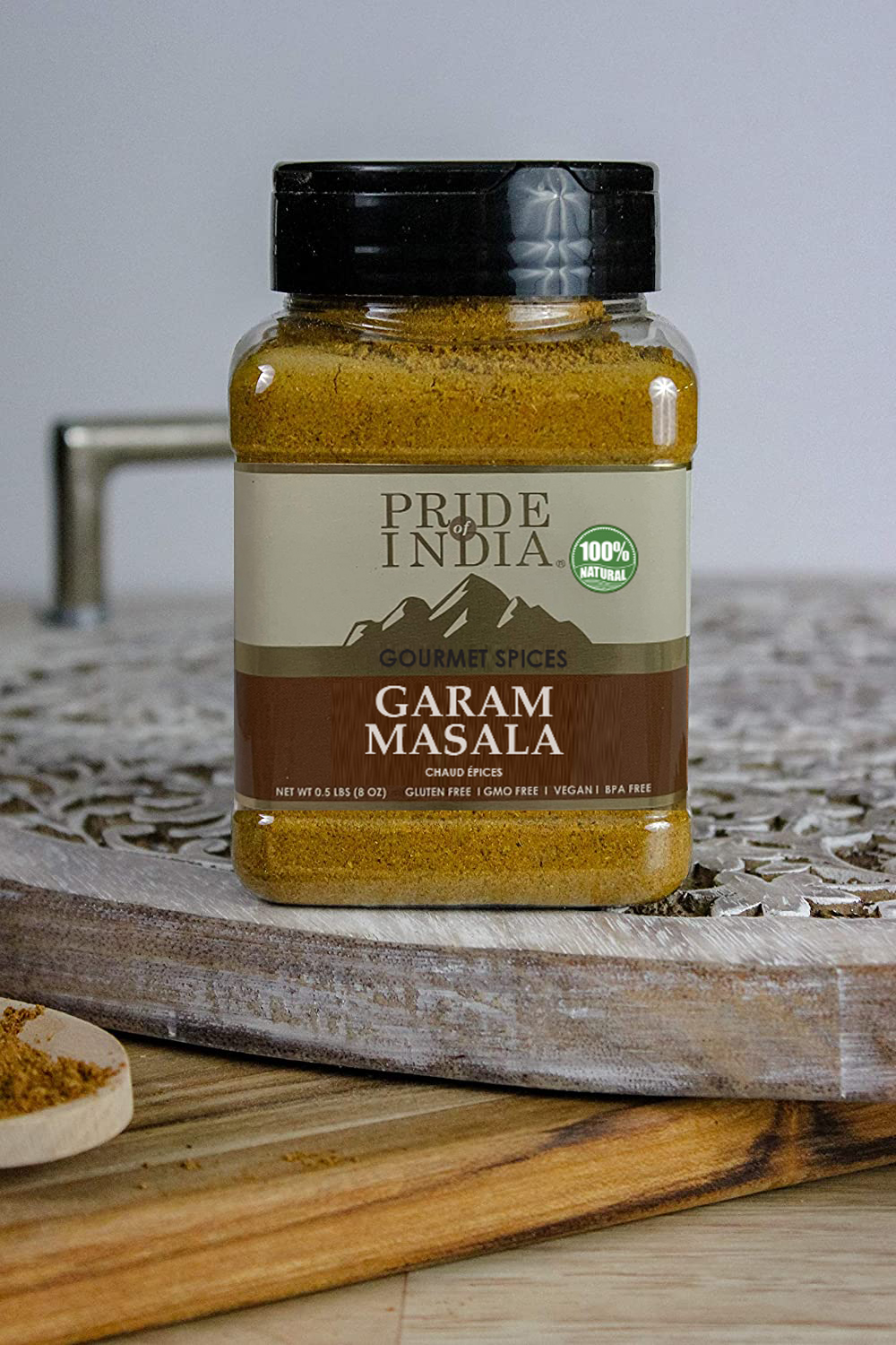 A jar of Pride of India Gourmet Garam Masala Ground, showcasing its rich brown color and spice blend.