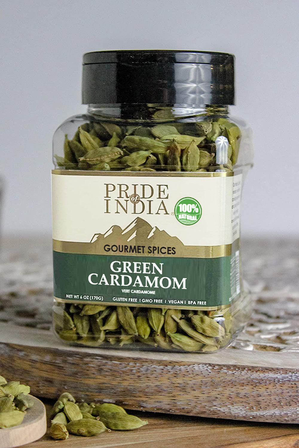 A close-up of whole green cardamom pods, showcasing their vibrant green color and unique shape, ideal for culinary use.