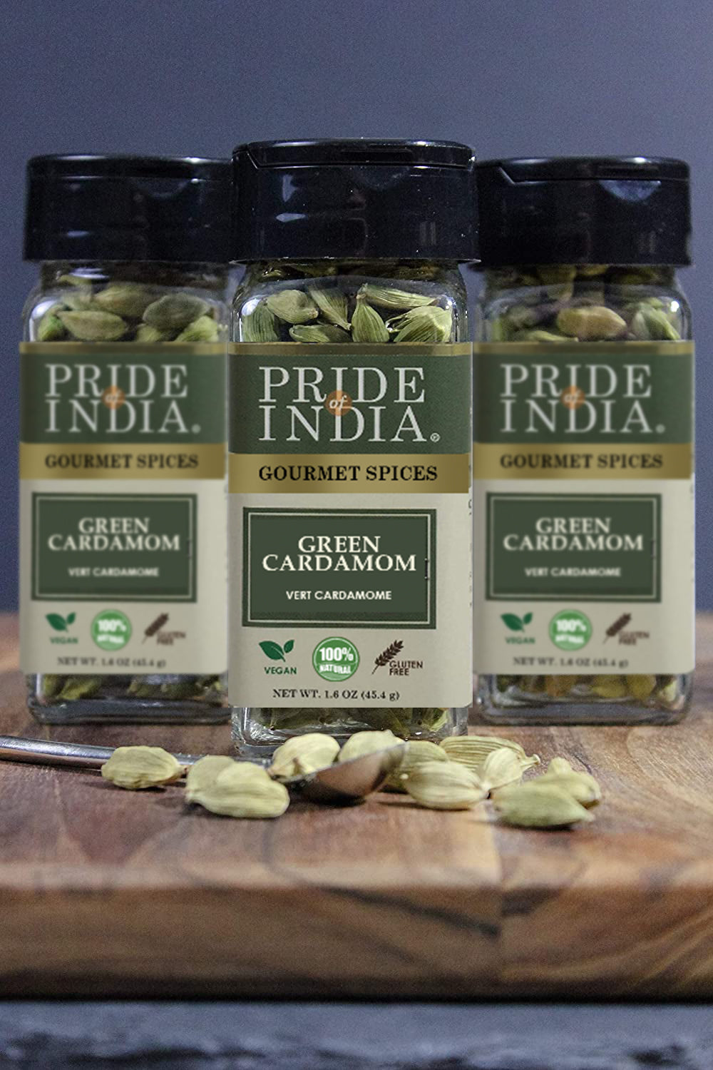 A close-up of whole green cardamom pods, showcasing their vibrant green color and unique shape, ideal for culinary use.