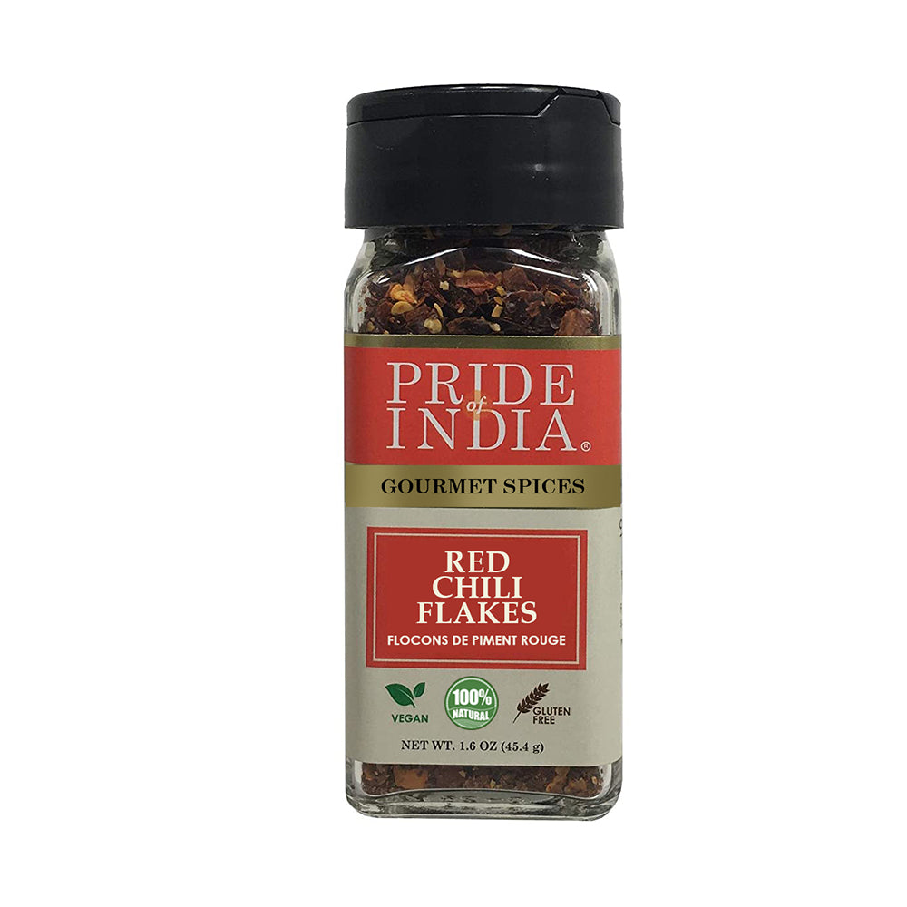 A jar of Pride Of India Gourmet Red Chili Flakes Hot, showcasing vibrant red crushed chili peppers, ideal for adding spice to dishes.