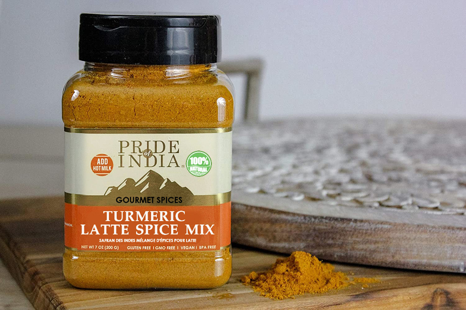 A vibrant jar of Gourmet Turmeric Latte Tea Spice Mix showcasing the blend of spices including turmeric, cinnamon, and ginger.