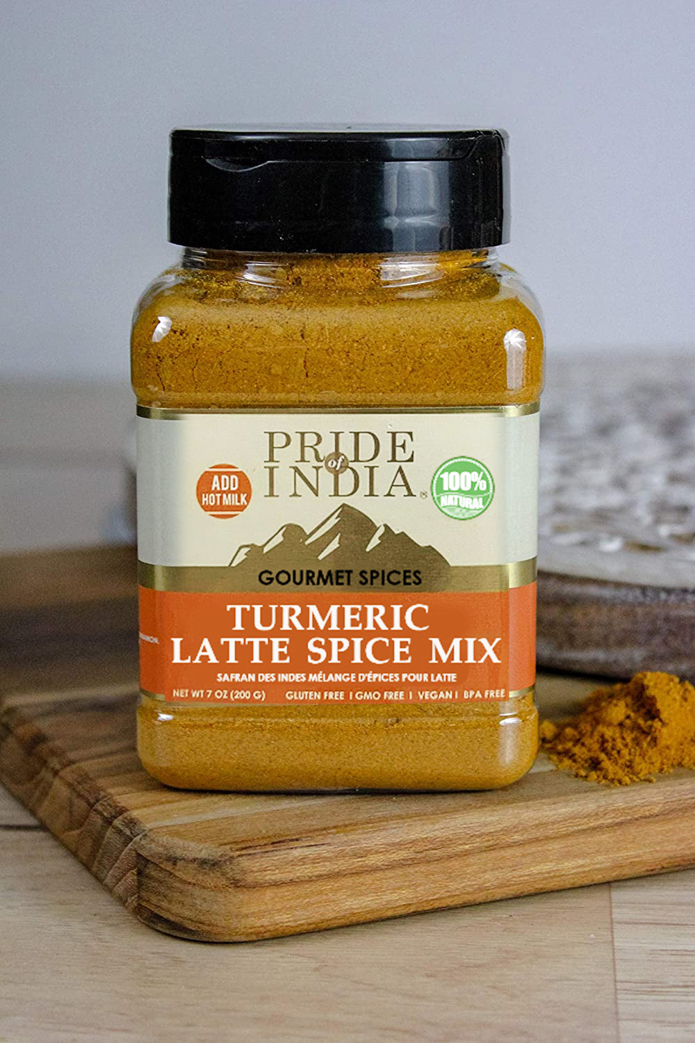 A vibrant jar of Gourmet Turmeric Latte Tea Spice Mix showcasing the blend of spices including turmeric, cinnamon, and ginger.