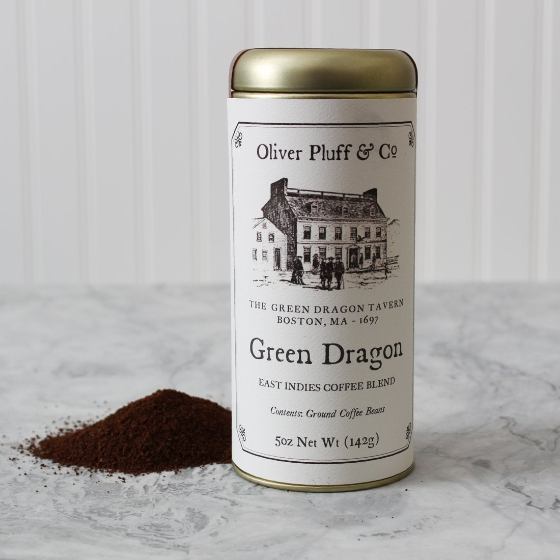 A tin of Green Dragon Ground Coffee featuring a rich blend of Sumatra and Java beans, showcasing its historical significance and premium quality.