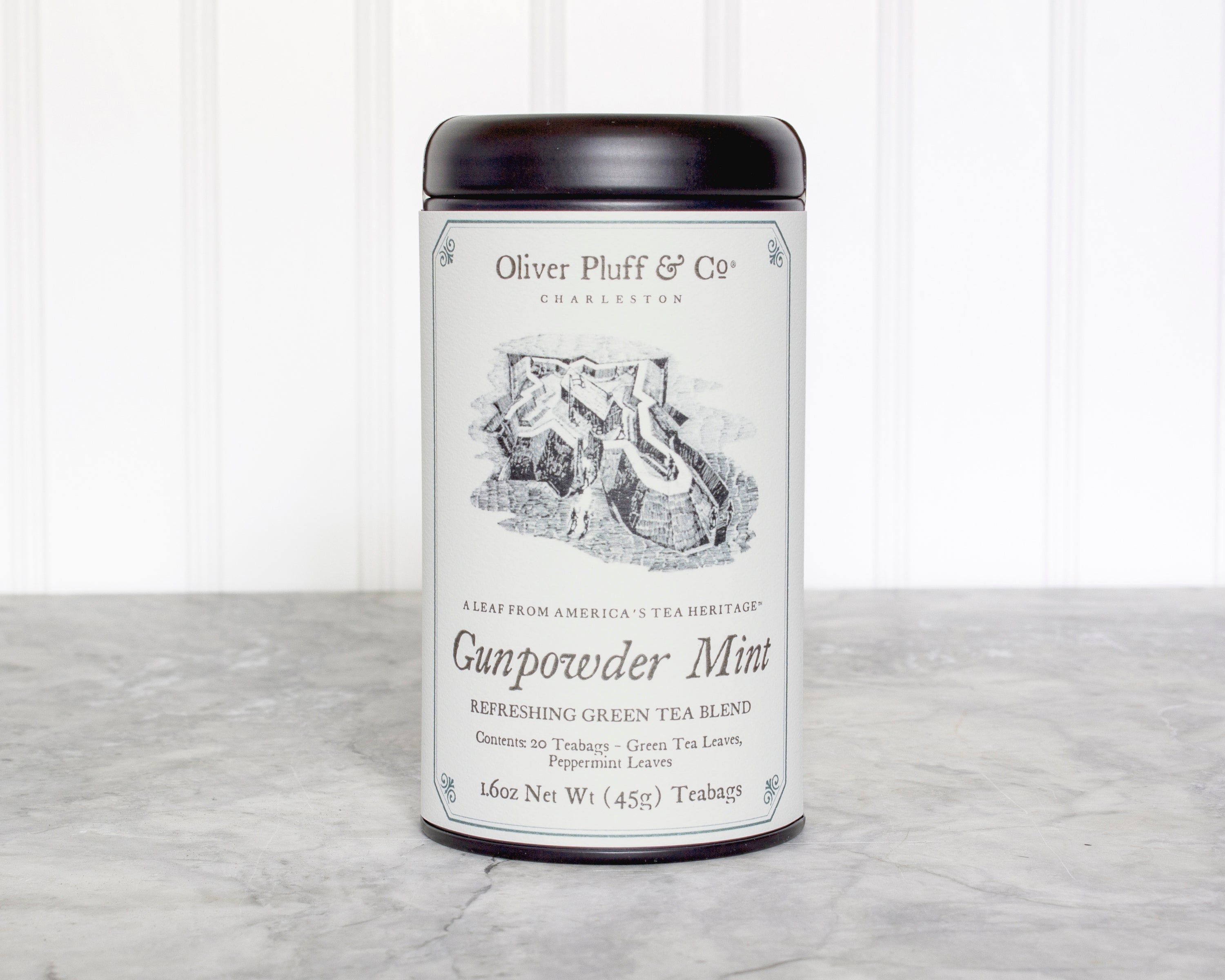 Gunpowder Mint Teabags in a matte black signature tea tin, showcasing the elegant packaging and teabag design.