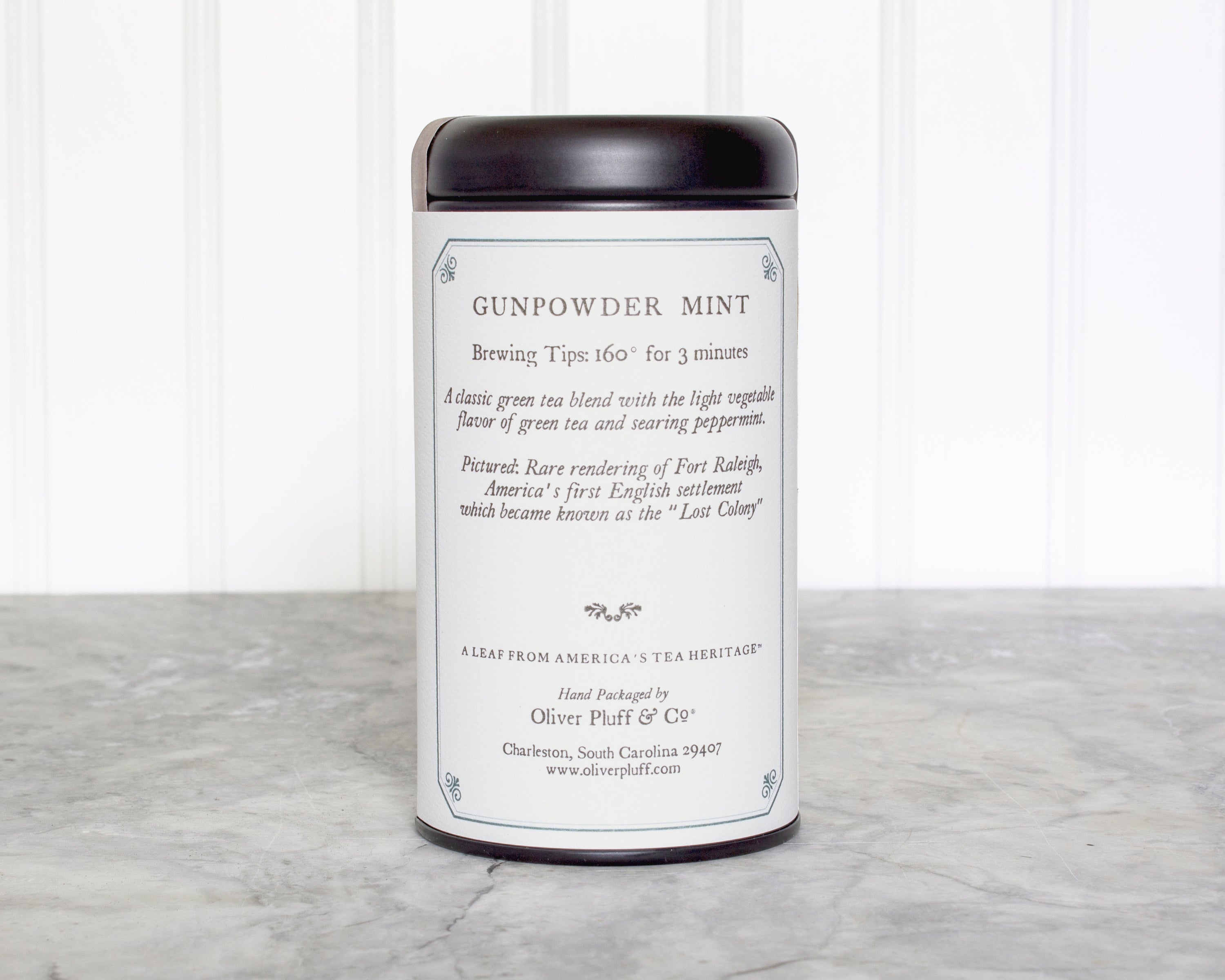 Gunpowder Mint Teabags in a matte black signature tea tin, showcasing the elegant packaging and teabag design.