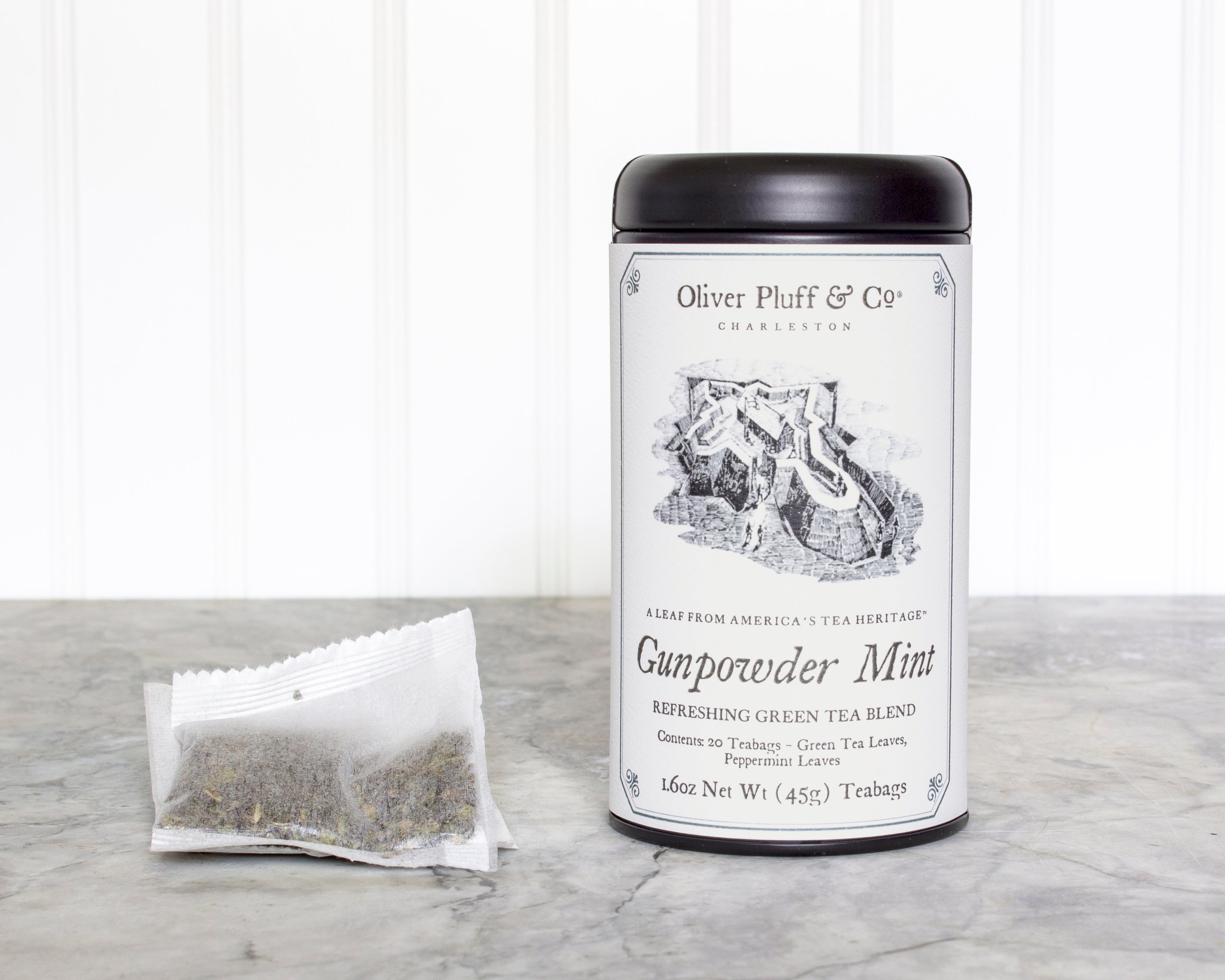 Gunpowder Mint Teabags in a matte black signature tea tin, showcasing the elegant packaging and teabag design.