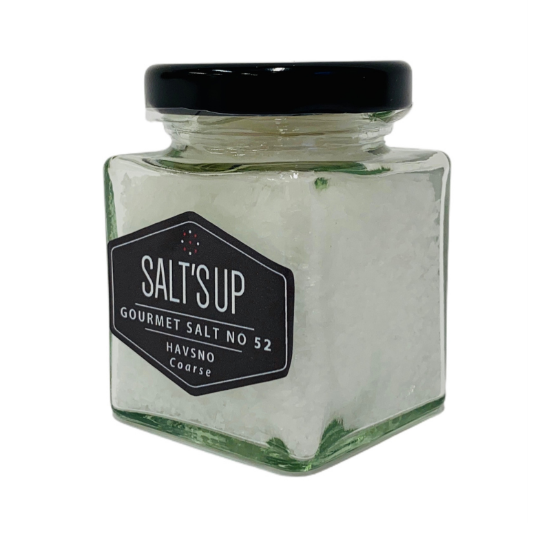 HAVSNO sea salt in a stylish glass jar, showcasing its coarse white flaky texture, perfect for culinary use.