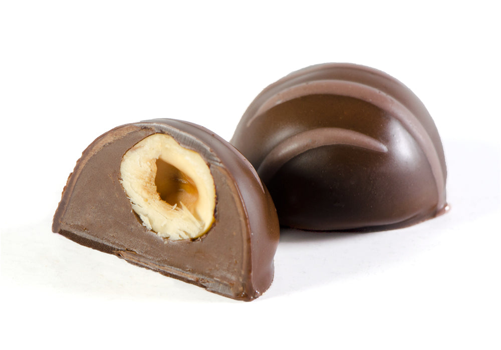 A luxurious Hazelnut Truffle, showcasing rich chocolate and crunchy hazelnuts, beautifully packaged.