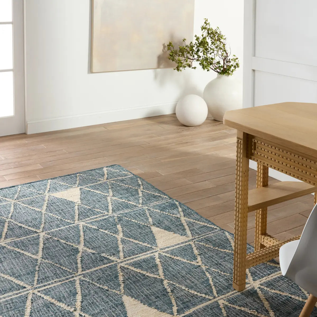 Helina rug featuring a navy and beige trellis pattern, handcrafted from jute and cotton, ideal for modern coastal decor.