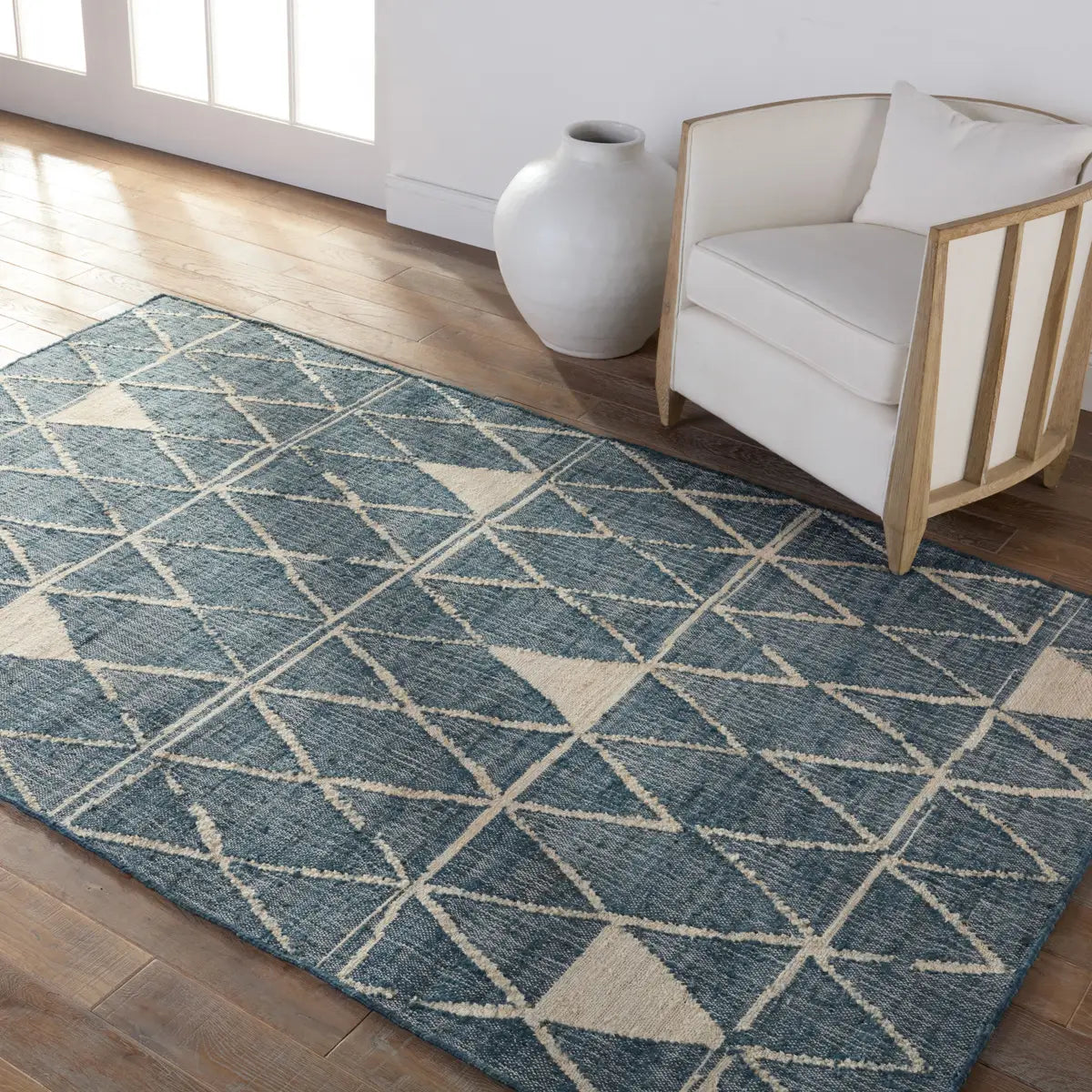 Helina rug featuring a navy and beige trellis pattern, handcrafted from jute and cotton, ideal for modern coastal decor.