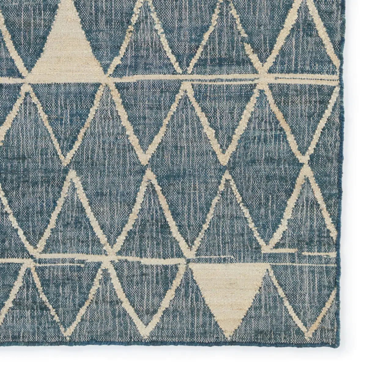 Helina rug featuring a navy and beige trellis pattern, handcrafted from jute and cotton, ideal for modern coastal decor.