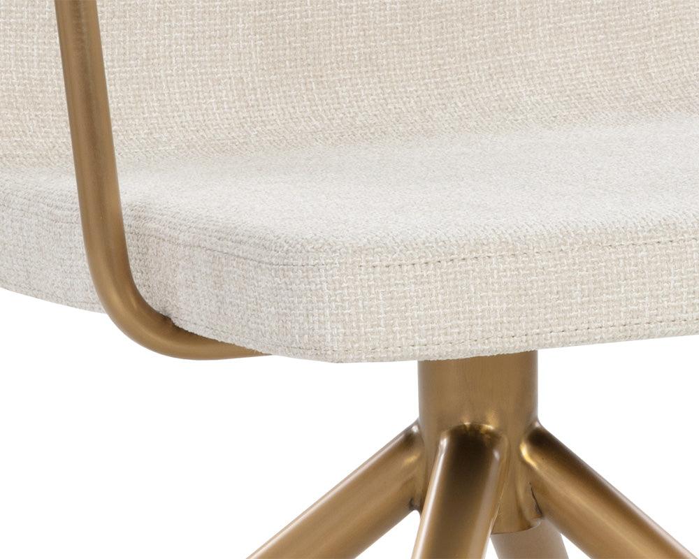 Hilda Swivel Dining Armchair in Chacha Cream with stainless steel base and gold finish, showcasing its elegant design and comfortable seating.