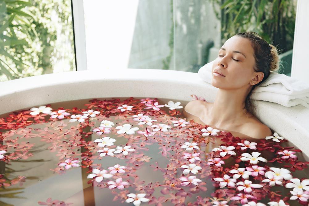 A jar of Himalayan Pink Bathing Salt enriched with Lavender Oil, showcasing its natural reddish-pink color and therapeutic properties.