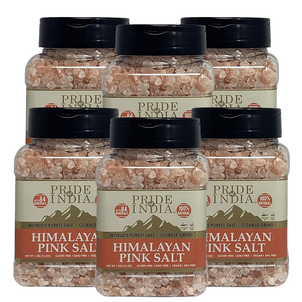 Coarse grind Himalayan pink rock salt in a wooden bowl, showcasing its natural reddish-pink color and texture.