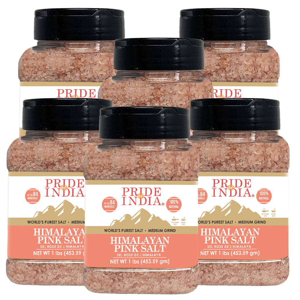 A bowl of Himalayan Pink Rock Salt - Medium Grind showcasing its coarse texture and reddish-pink color, ideal for cooking and therapeutic uses.