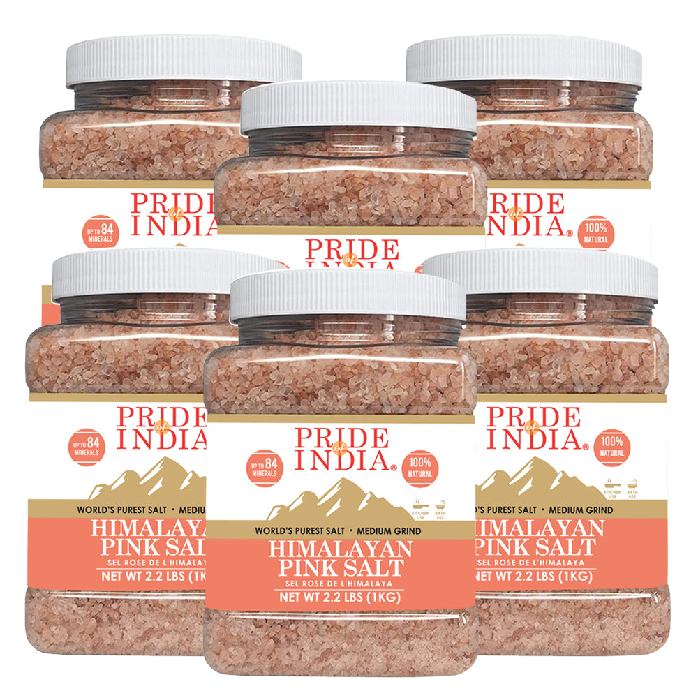 A bowl of Himalayan Pink Rock Salt - Medium Grind showcasing its coarse texture and reddish-pink color, ideal for cooking and therapeutic uses.