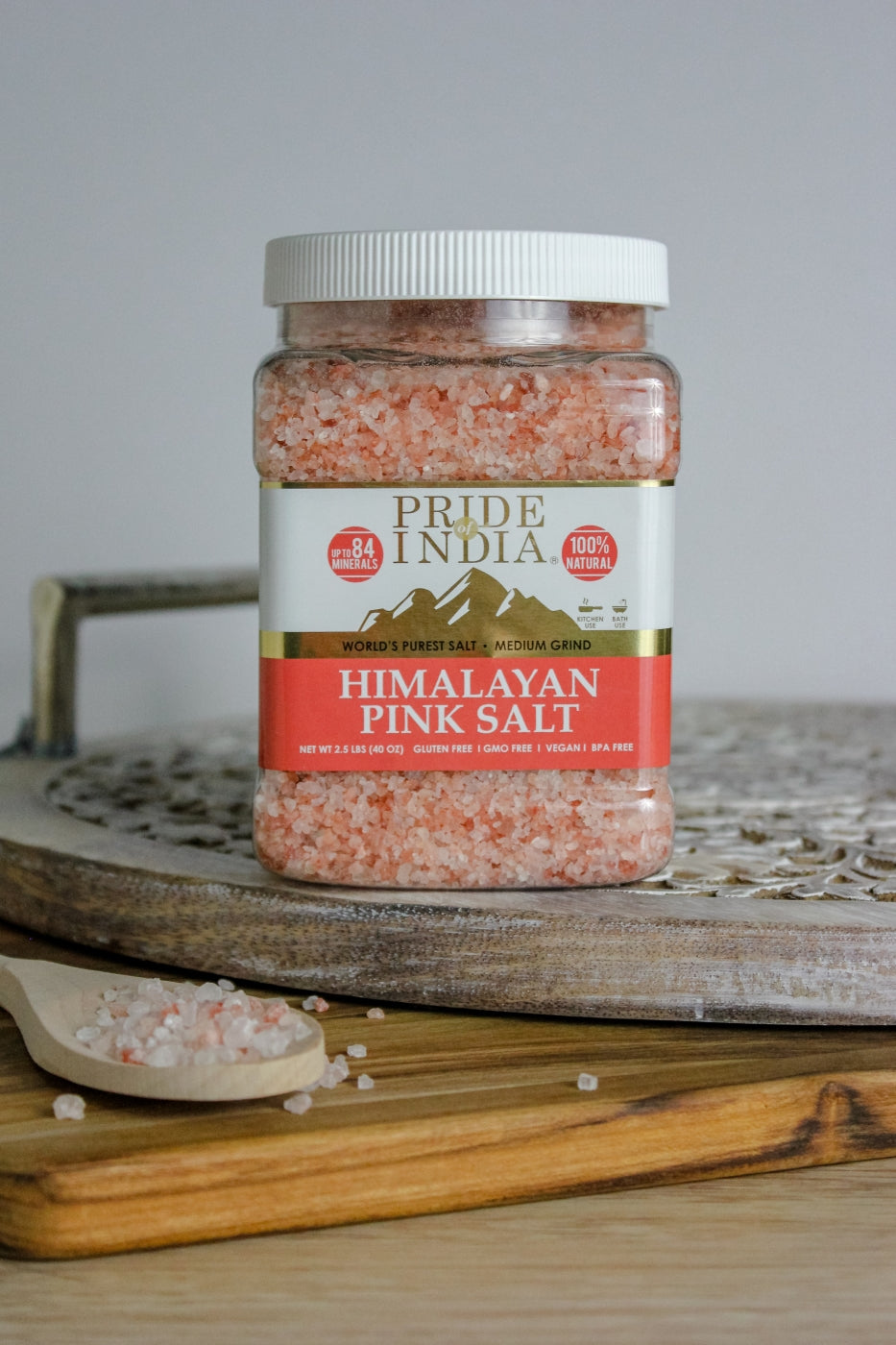 A bowl of Himalayan Pink Rock Salt - Medium Grind showcasing its coarse texture and reddish-pink color, ideal for cooking and therapeutic uses.