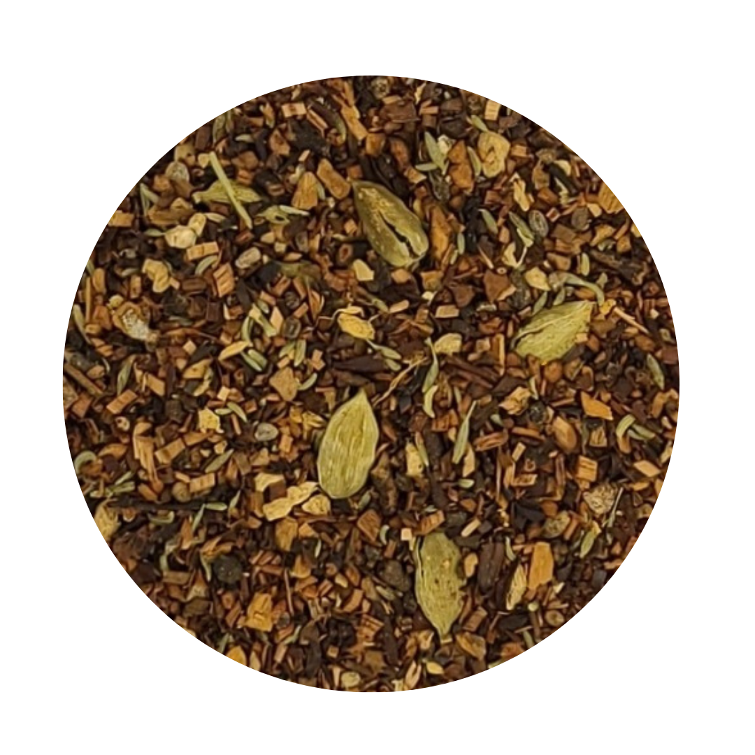 A cup of Honey'd Chai herbal tea with spices and honeybush leaves, showcasing its rich color and inviting aroma.