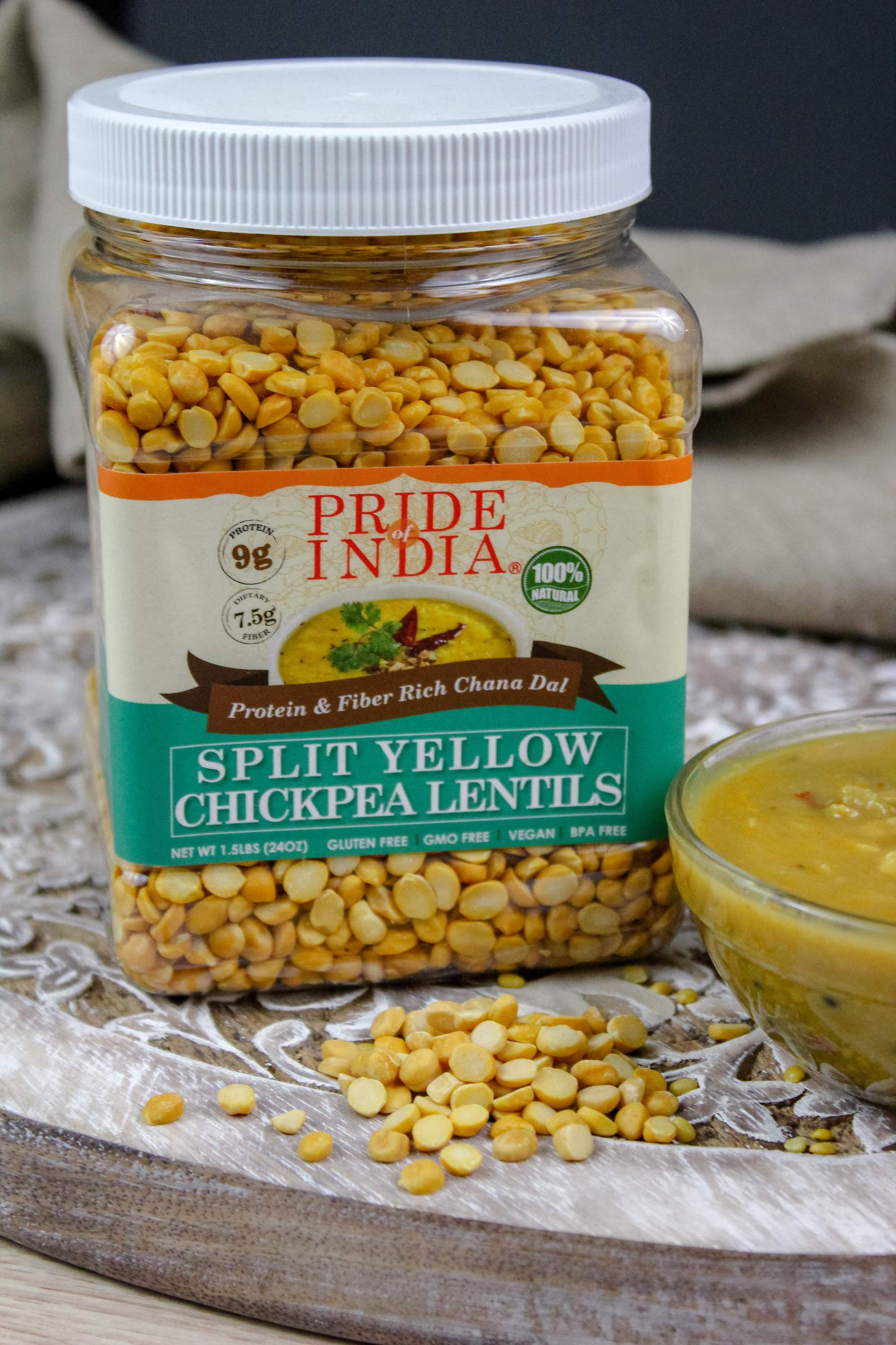 A jar of Indian Split Yellow Chickpea Lentils (Chana Dal) showcasing its natural color and texture, ideal for healthy cooking.