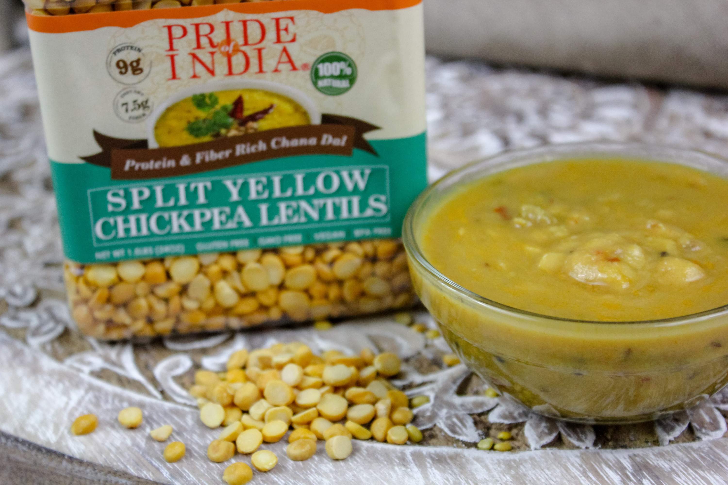 A jar of Indian Split Yellow Chickpea Lentils (Chana Dal) showcasing its natural color and texture, ideal for healthy cooking.