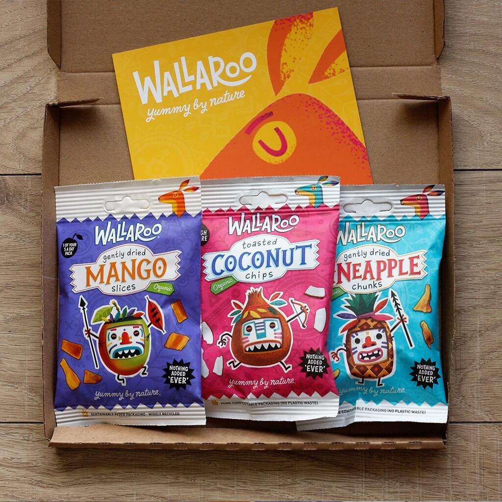 Introductory Tropical Tasting Bundle featuring organic mango, pineapple, and coconut snacks in eco-friendly packaging.