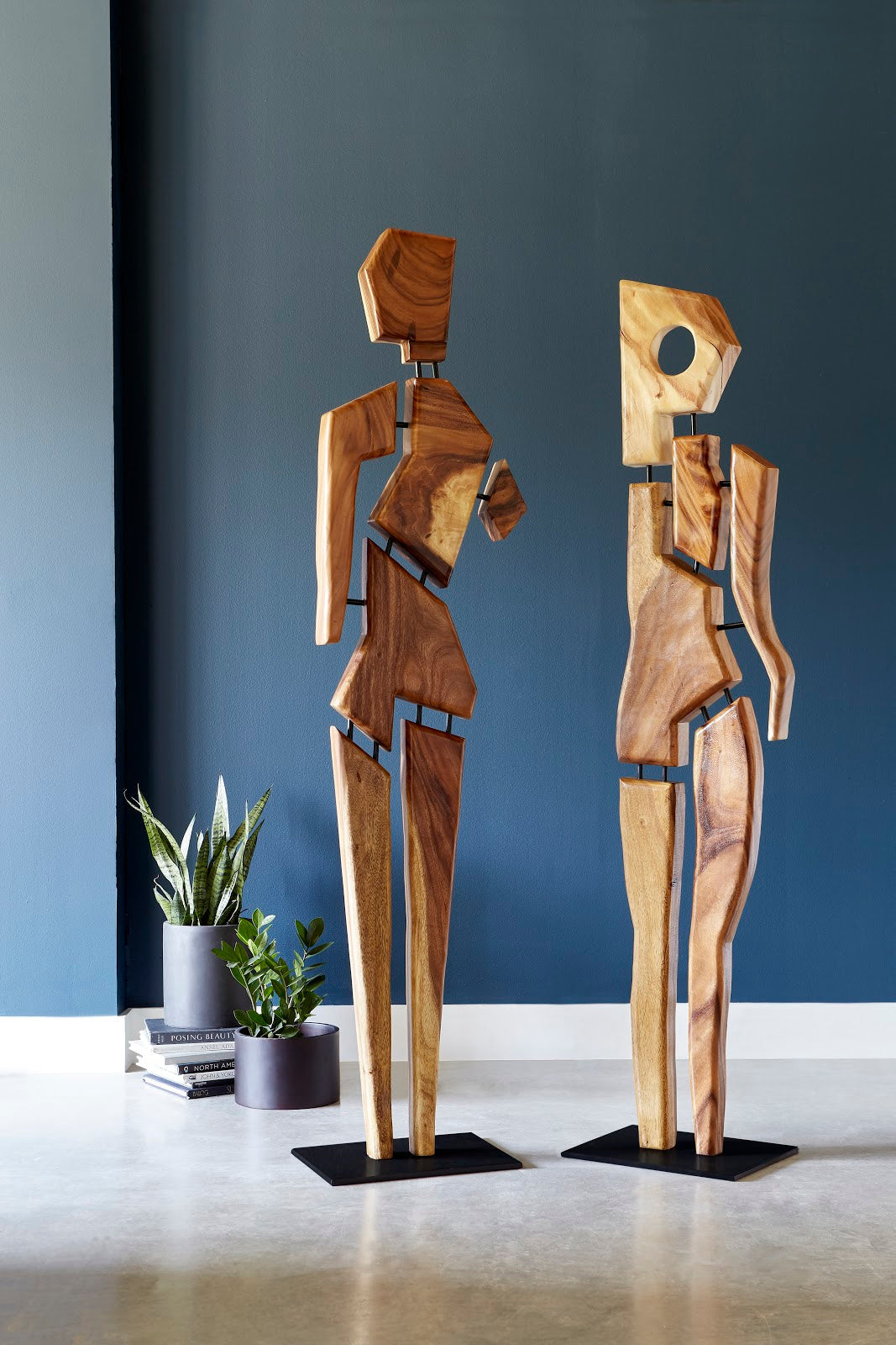 Tall Jack Wood Sculpture made from solid acacia wood with an iron base, showcasing unique grain patterns and a contemporary design.