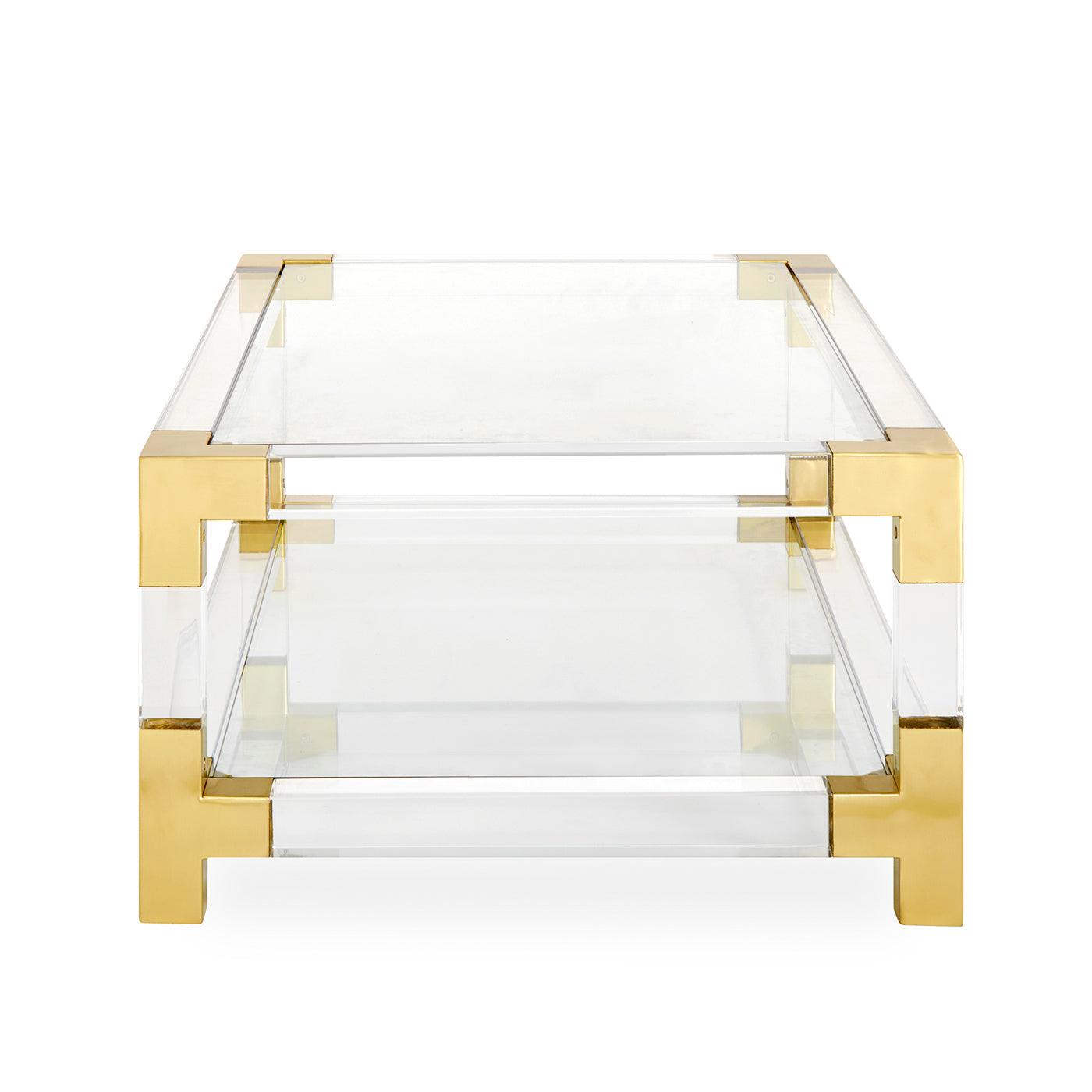 Jacques Grand Cocktail Table featuring clear acrylic and brushed brass accents, showcasing its elegant design and tempered glass shelf.