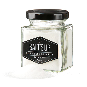 Kalahari fine salt in a 100g jar, showcasing its pure white color and fine texture, sourced from the untouched Kalahari Desert.