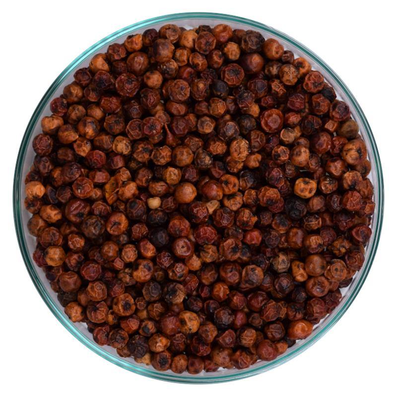 A glass jar of KAMPOT RED pepper showcasing its vibrant red color, symbolizing its unique flavor and aromatic qualities.