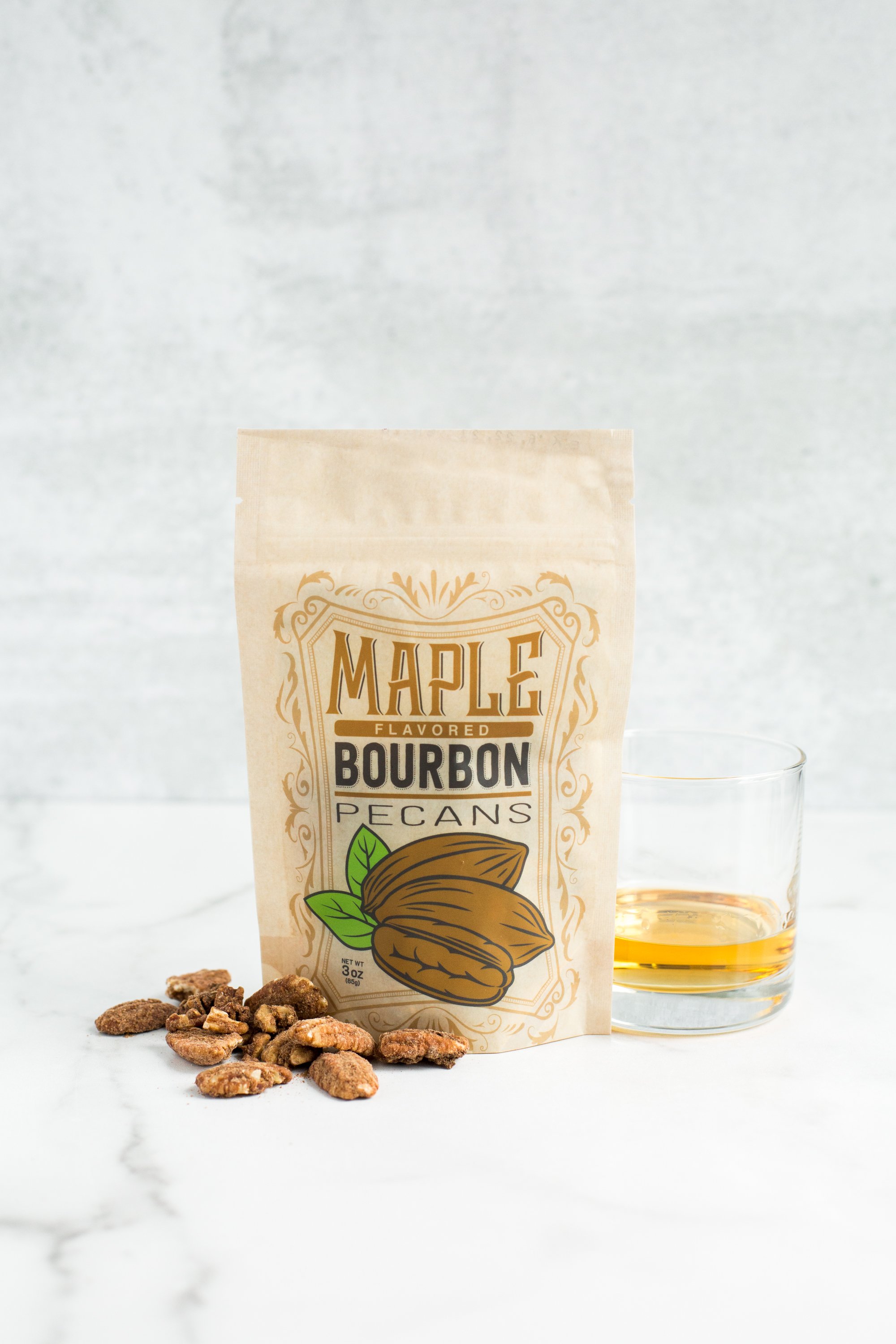 Five bags of Kettle-Cooked Maple Bourbon Pecans, showcasing their crunchy texture and rich flavor.