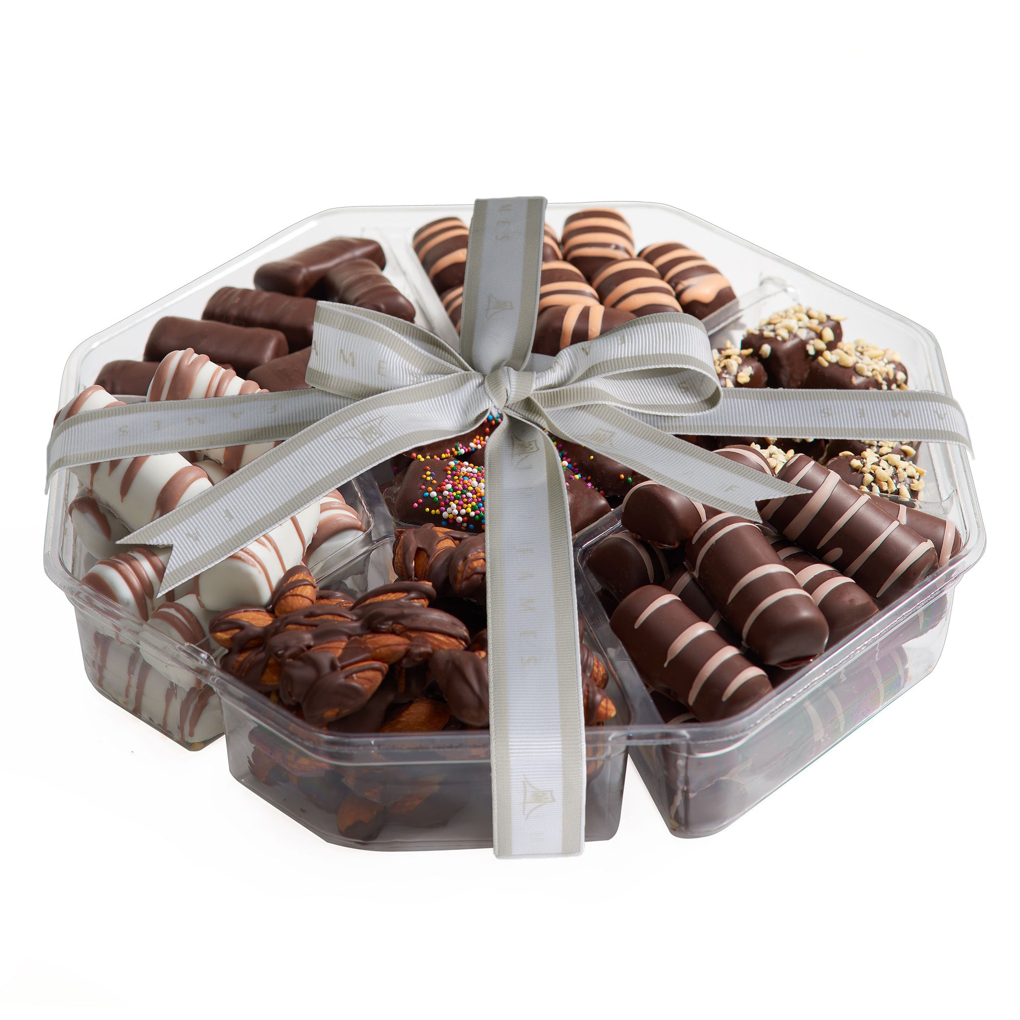 A beautifully arranged Kosher Chocolate Assortment featuring various gourmet chocolates including almond patties, hazelnut truffles, and fruity sticks.