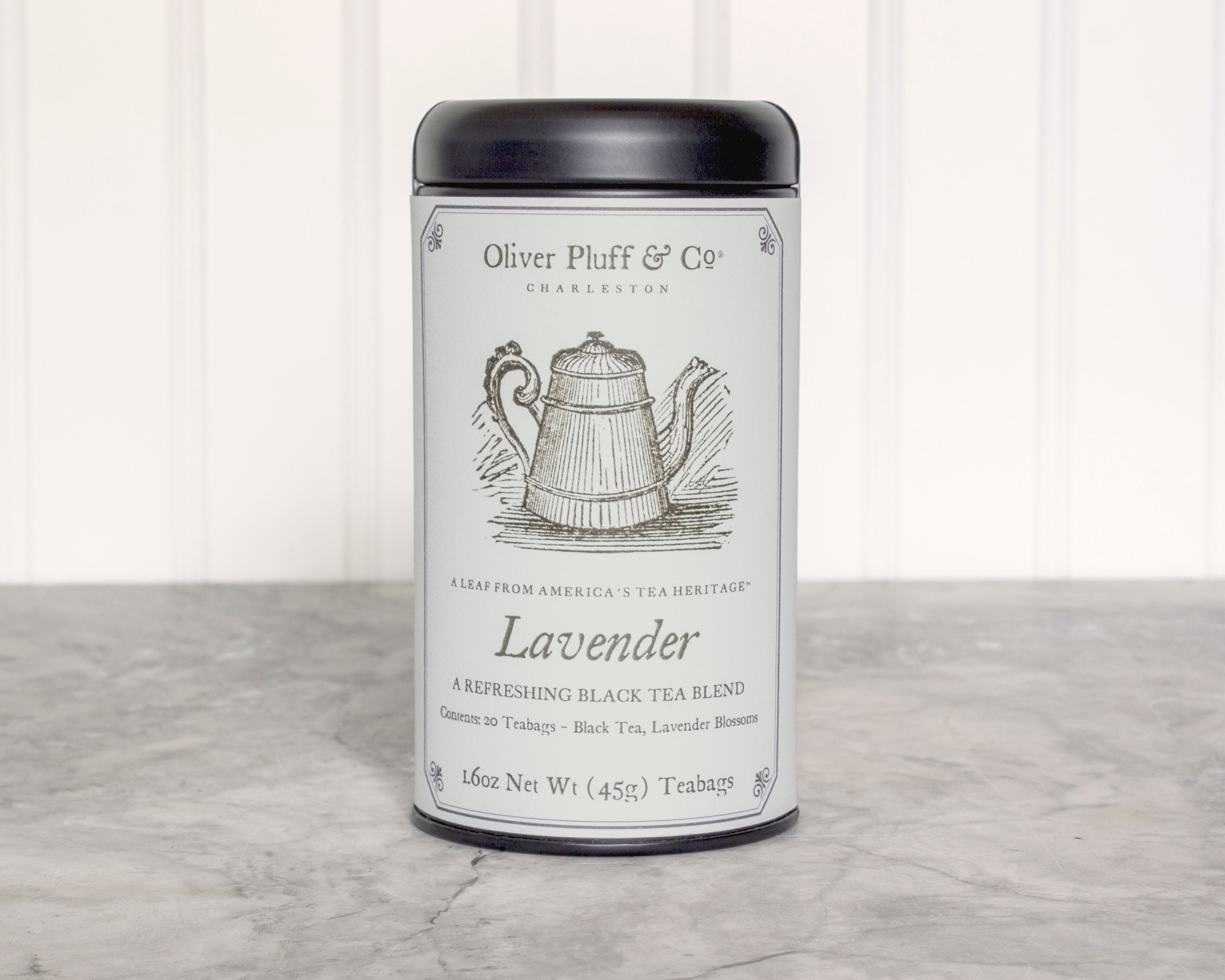 Lavender Teabags Tea Tin featuring 20 pillow sachets of aromatic black tea blended with lavender blossoms, elegantly packaged in a matte black tin.