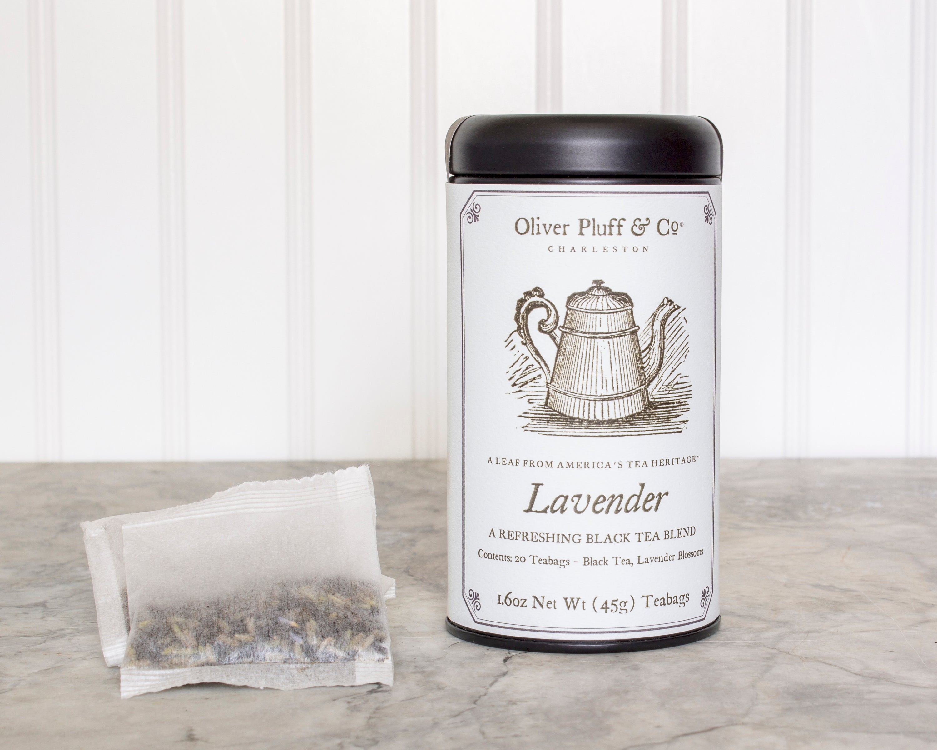 Lavender Teabags Tea Tin featuring 20 pillow sachets of aromatic black tea blended with lavender blossoms, elegantly packaged in a matte black tin.