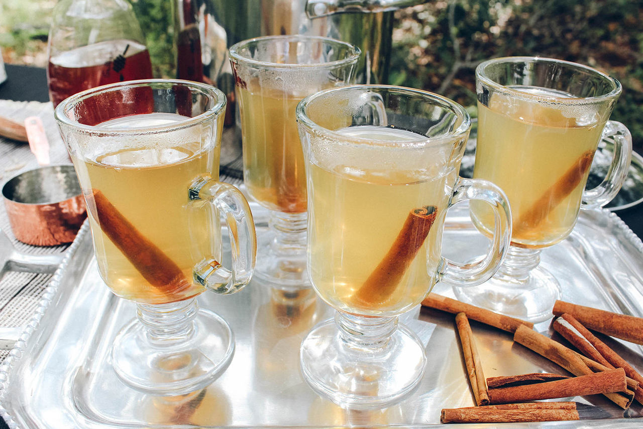 Lemon Ginger Hot Toddy Kit featuring muslin spice bags, cinnamon sticks, and dried lemon and ginger ingredients.