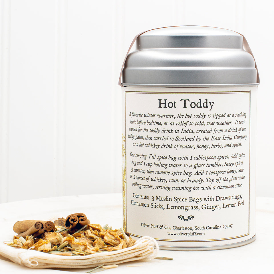 Lemon Ginger Hot Toddy Kit featuring muslin spice bags, cinnamon sticks, and dried lemon and ginger ingredients.